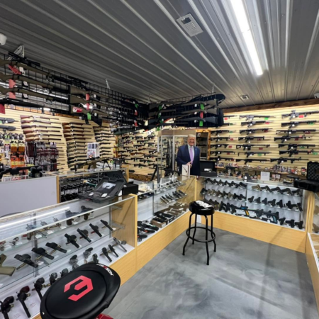 Gun store display cases person